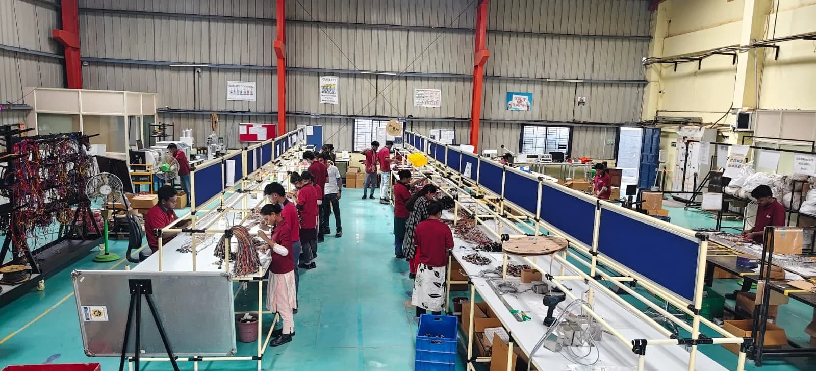 Operators at the harness assembly lines on the MGTPL shop floor in Bommasandra, Bengaluru.