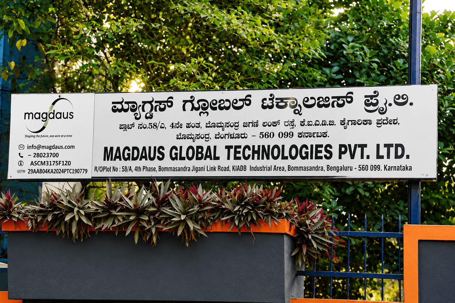 Magdaus Global Technologies Pvt. Ltd. signboard at the Bommasandra facility.
